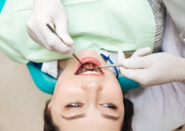 Patient opening mouth at the dentist