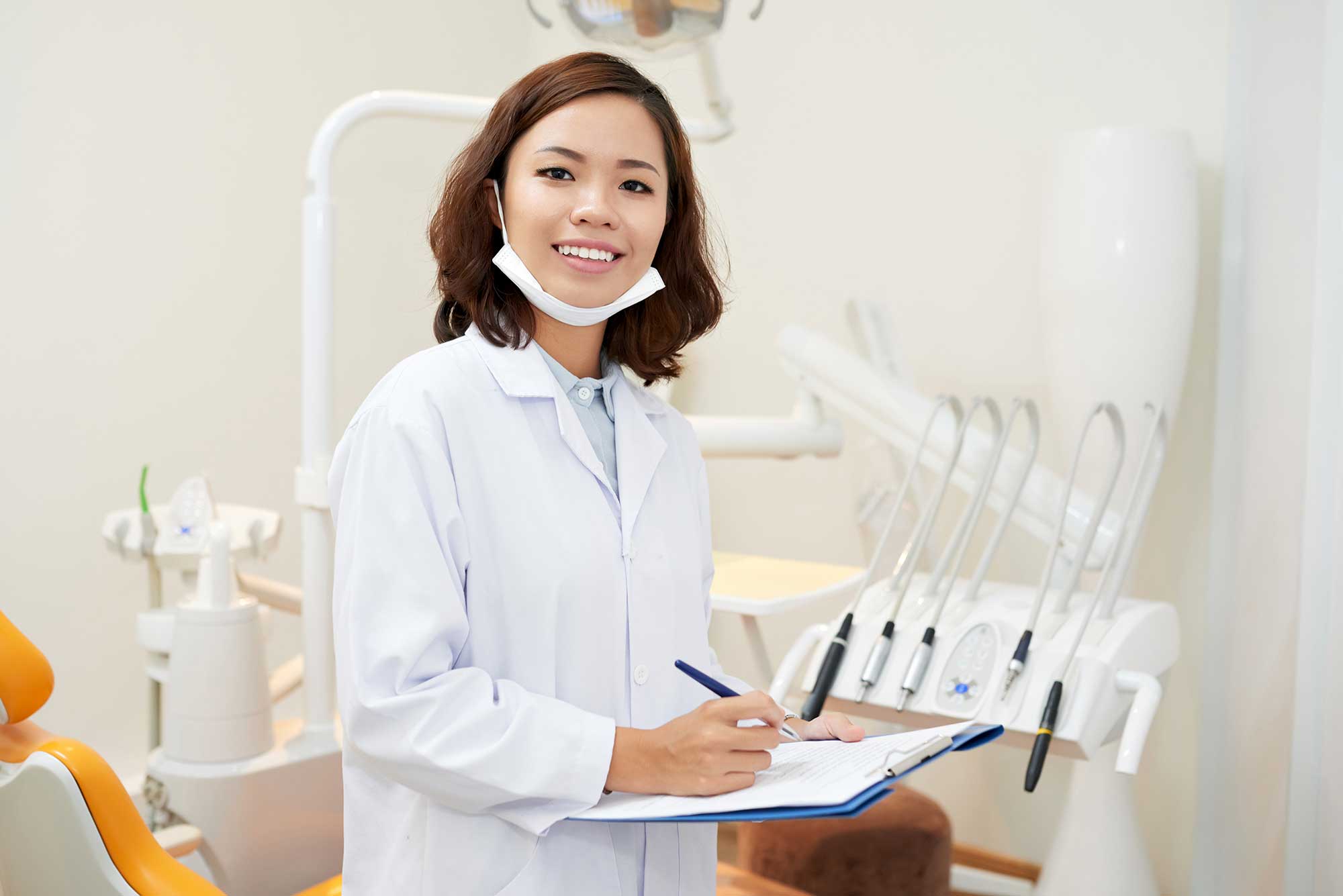 Female young dentist smiling