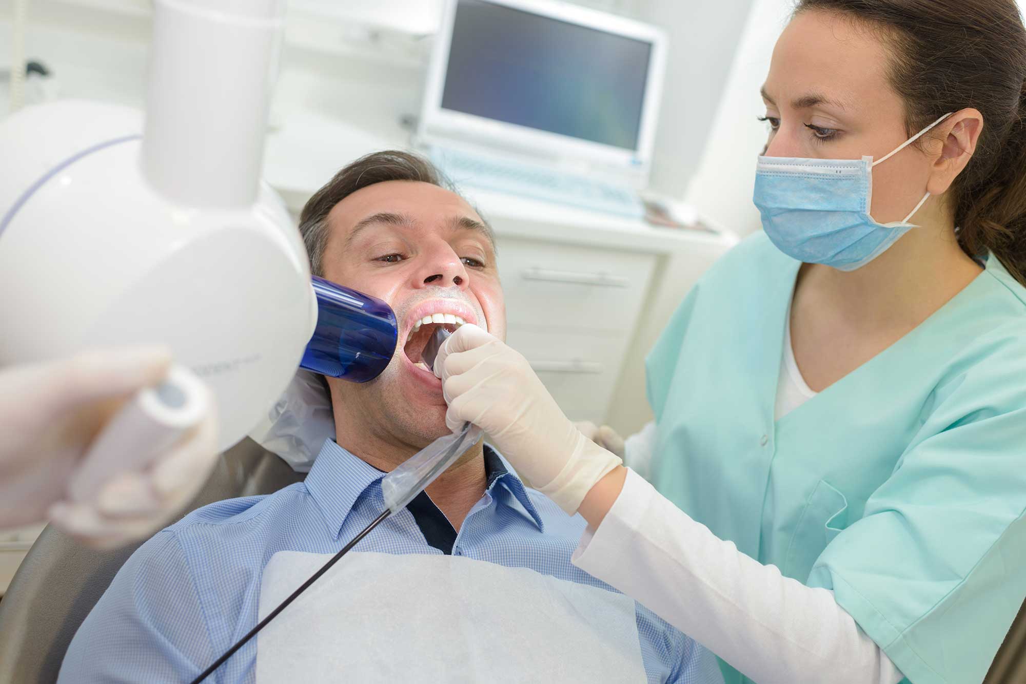 Dentist doing digital xray to a patient